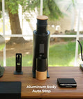 Solid Single Dose Coffee Grinder Featuring 63Mm Red Titanium Conical Burrs And Plasma Ionizer To Crush Beans Sick Flat And Eliminate Static Drama For Flawless Pulls In Sleek Black Housing on wooden counter with auto stop feature.