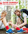 Small red travel first aid kit with 87 pieces; outdoors on hiking trail as man treats girl's knee