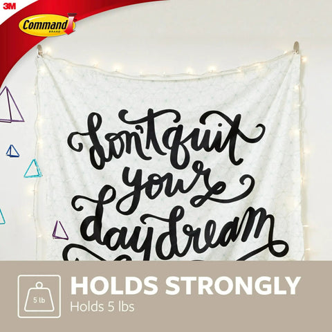 Image of a wall tapestry held by Large Designer Hook Holds Up To Five Pounds With Two Strips Brushed Nickel Finish Damage Free Wall Hook No Tools Needed For Quick Decor Hanging And Everyday Organization In Living Spaces.