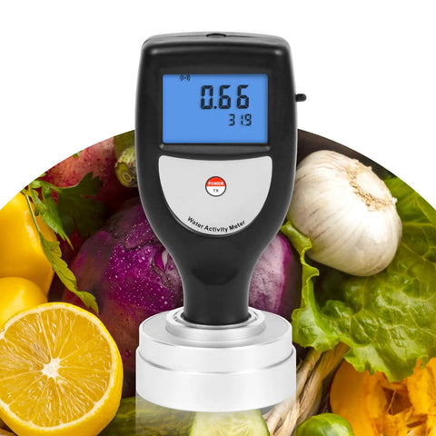 Portable Water Activity Meter For Food Testing With Software And USB Data Ultra Lightweight Under 100 Grams Ideal For On The Go Jerky And Freeze Dried Foods Delivers Accurate Readings From Zero To One Point Zero Aw in front of vegetables and fruits