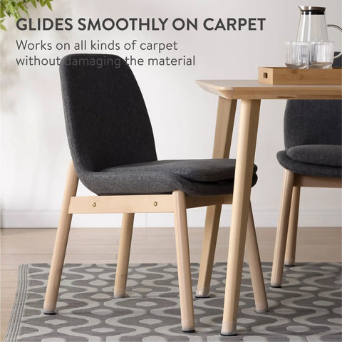 Effortless Carpet Gliding Chair Leg Sliders 8 Pack Clear Silicone With PTFE Bottom installed on chair leg