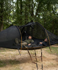 Two people relaxing in a Two Person Triangle Hammock Tent For Easy Lay Flat Comfort With Three Point Setup Including Bug Net And Rainfly
