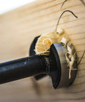 Forstner drill bit in wood, showcasing precise drilling with shavings, part of a five-piece set made of high-speed steel.