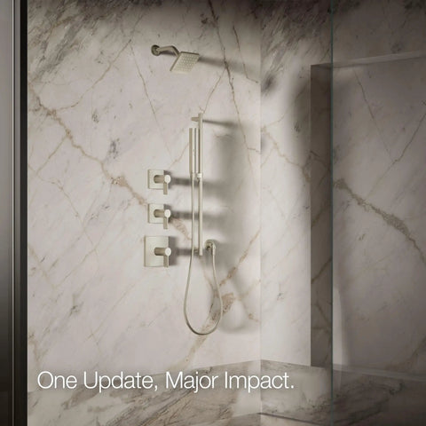 Marble bathroom showcasing the Parallel Single Function Showerhead With 1.75 GPM Flow, Vibrant Brushed Nickel Finish.