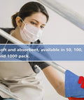 Blue 12x14 Inch Shop Towels Pack Of 50 Plus 5 Bonus Reusable Cleaning Rags For Garage Auto Painting Kitchen Bar Tough As Nails 100 Percent Cotton Absorbent Towels Workhorse being used by person cleaning metal rail