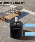 Top Shelf 170Kv Brushless Outrunner Motor With Hall Sensor Delivering A Beast Mode 2300W Output And 4080Rpm Spins For Electric Scooter Skateboard Surfboard DIY EV Builds In Black next to a skateboard, showcasing its compact size.