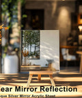 Silver mirror acrylic sheet on a small wooden easel in a sunlit room