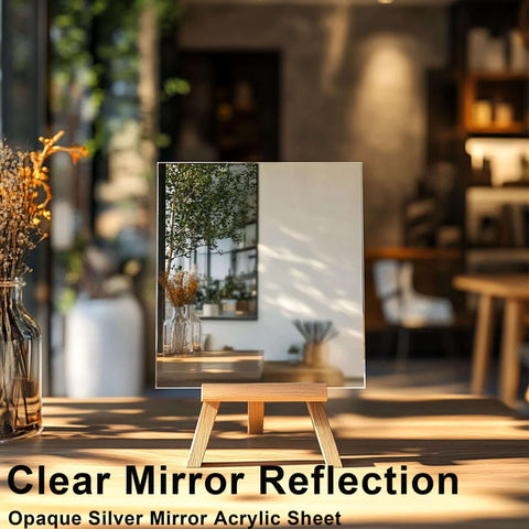 Silver mirror acrylic sheet on a small wooden easel in a sunlit room