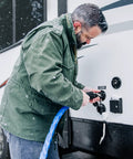 Man connecting Heated Water Hose For RV Beefed Up 50 Feet Freeze Protection To Minus Twenty Degrees Drinking Water Safe And Lead Free