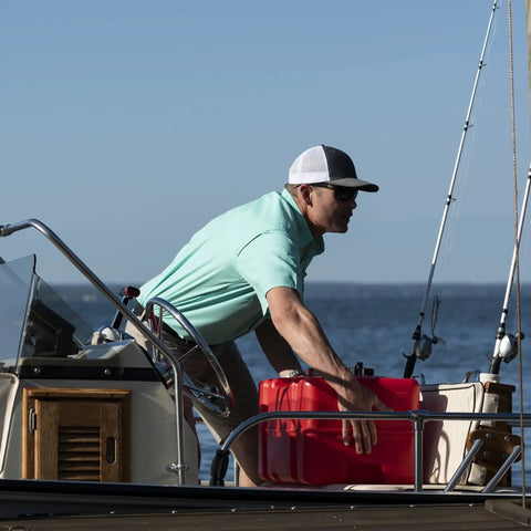 Man handling Portable 12 Gallon Marine Gas Can With Built In Fuel Gauge And Pick Up Cap 2 Way Vented Cap on a boat deck