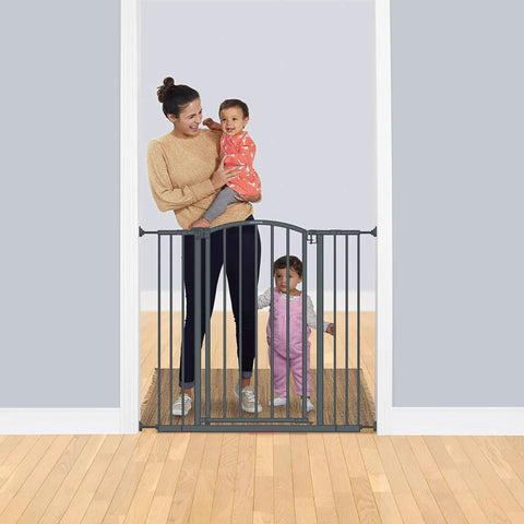 Woman with children by Extra Tall Decor Safety Gate For Kids And Pets In Gray Fits Openings From 28 To 38.25 Inches Wide And 36 Inches High