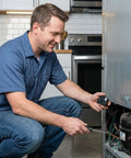 Man installing Fridge Compressor Start Relay And Overload Protector Kit 4 7 Ohm 1 Pin PTC in a refrigerator.