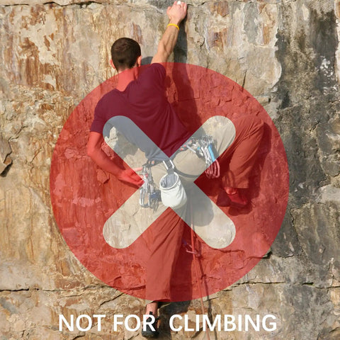 Man climbing rock surface with "Not for Climbing" warning, not using 3 Inch Black Aluminum Carabiner Clips 10 Pack Dual Style D Ring And Snap Hook.