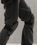 Hella Tough Dual Knee Guards For Mechanics And Tradesmen Job Site Ready Heavy Duty Protective Work Pads on gray pants.