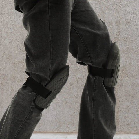 Hella Tough Dual Knee Guards For Mechanics And Tradesmen Job Site Ready Heavy Duty Protective Work Pads on gray pants.