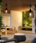 Battery Powered Hanging Pendant Light Outdoor Waterproof Chandelier With 6 Hour Timer illuminating a cozy patio setting.