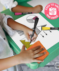 Child using Flexible Dry Erase Sheets 9x12 Pack Of 10 For Math Practice And Graphing, drawing shapes with markers on quad grid sheet.