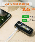 1000 Lumen Rechargeable LED Flashlight With Red Blue Front Light And White Side Light charging via USB-C on wooden table
