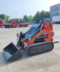 Red mini skid steer loader with 1800 lb capacity, 23HP gas EPA engine parked outdoors, suitable for construction and landscaping.