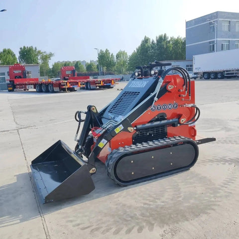 Red mini skid steer loader with 1800 lb capacity, 23HP gas EPA engine parked outdoors, suitable for construction and landscaping.