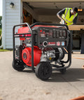 8,200 Watt Dual Fuel Portable Generator With 322cc OHV Engine, CO Sensor near worker in garage