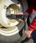 Person using Roadside Ready 1 Inch Drive Torque Multiplier Wrench For Quick Removal Of Rusted Lug Nuts on truck wheel