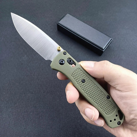 Razor Sharp 3-Inch Folding Pocket Knife with Coated Plain Edge Blade and Solid Grivory Handle held in hand, displaying sharp blade.