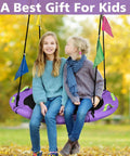 Two children sitting on purple Tree Swing Saucer For Kids 40 Inch Heavy Duty With Adjustable Straps 900 Lbs Capacity in autumn park.
