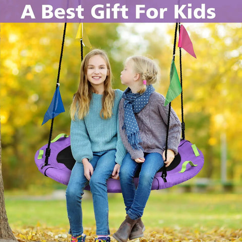 Two children sitting on purple Tree Swing Saucer For Kids 40 Inch Heavy Duty With Adjustable Straps 900 Lbs Capacity in autumn park.