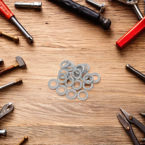 30 Pair M10 Double Layer Self Locking Wedge Shaped Anti Vibration Safety Washers Built From Heavy Manganese Steel on a workbench.
