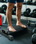 Premium Steel Calf Raise Block And Stretch Board For Savage Leg Days Adjustable Incline Platform used for calf raises.