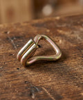 Heavy-Duty Zinc Plated Double J Hooks Set For Ratchet Straps, 1 Inch Truck Straps With Antislip Surface, close-up on wooden surface