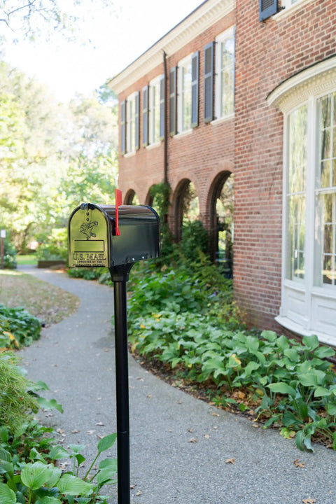 Coolidge Galvanized Steel Mailbox Post in Black for Outdoor Use installed in garden path