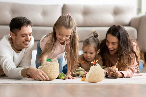 Family playing with Jumbo Dino Egg Surprise With Twelve Collectible Dinosaurs Inside One Giant Easter Egg For Easter Gifts