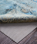 Close-up of Rug Gripper Pad For Hardwood Or Tile Floors 2x3 Ft Thick Non Slip Under Rug Mat Keeps Rugs From Bunching And Sliding.