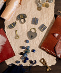 Two Piece Antique Bronze Hasp Latch Set with 27x30mm hasp latch, 24x21mm mini box hinges, 22x38mm love locks, and keys displayed on paper