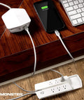 Vertex Six Outlet Power Center Surge Protector With Four Foot Detachable Magnetic Mount And USB Hub Two USB A And One USB C For Computers TVs Audio Gear White shown on desk with phone charging