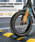 Beast Electric Bike For Adults With 1800W Peak Motor, featuring front fork shock suspension over a speed bump, close-up view.