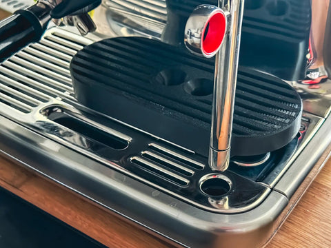 Level Up Your Counter Game With This Heavy Duty Cup Riser Platform designed to elevate espresso mugs by thirty millimeters on espresso machine.