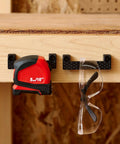 Rugged Tape Measure Holder For Garage Organization, Keeps Tools Handy On Ladder Or Workbench, Grab-And-Go Quick Install Tool Hook Pack Of 4, Built To Last, Versatile, Yellow securing tape measure and safety glasses on workbench