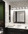 Bathroom with Lit Three Light Chrome Vanity Light Bar with Dimmable LED Heads above mirror.