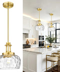 JAZAVA 10-Inch Brushed Gold Pendant Light, Modern Farmhouse Hanging Fixture with Ribbed Glass Shade above kitchen island.