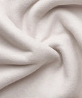 Close-up of cream velvet fabric used in Cute Velvet Desk Chair With Wheels For Home Office Vanity And Study, showcasing texture.