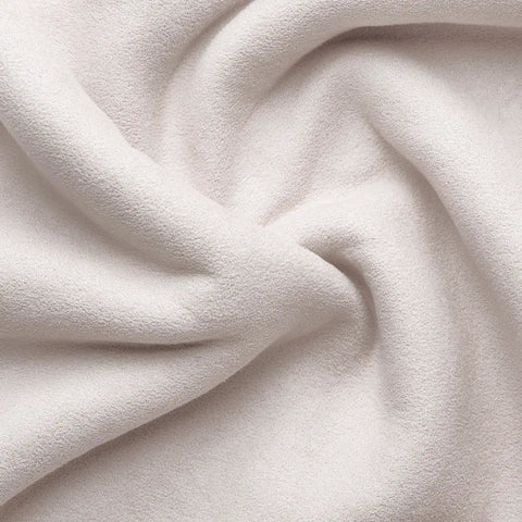 Close-up of cream velvet fabric used in Cute Velvet Desk Chair With Wheels For Home Office Vanity And Study, showcasing texture.