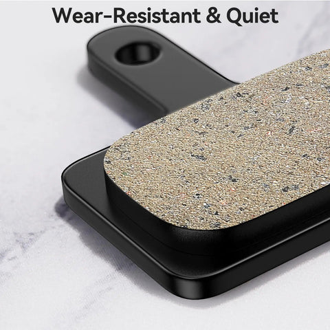 Close-up of Beefy Stopping Power Low Noise Resin Disc Brake Pads For Mountain Bikes, textured surface and black base detail.
