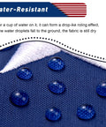 Heavy Duty 3x5 Outdoor American Flag Built Tough From Polyester With Embroidered Stars And Sewn Stripes Brass Grommets All Weather US Flag showcasing water resistance on fabric close-up.