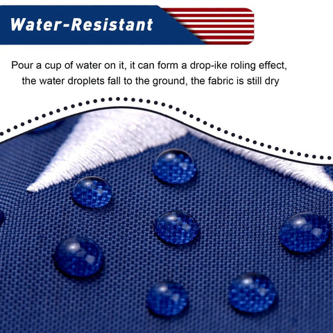 Heavy Duty 3x5 Outdoor American Flag Built Tough From Polyester With Embroidered Stars And Sewn Stripes Brass Grommets All Weather US Flag showcasing water resistance on fabric close-up.