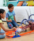 Children playing with Hot Wheels RacerVerse Spider-Man Web-Slinging Speedway Track Set With Spider-Man And Black Panther Epic Multi-Lap Race