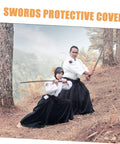 Two martial artists with swords, showcasing a protective black cotton cloth Japanese carrying bag for safe transport and display.