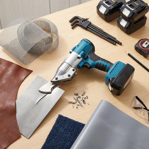 Aolidsive Cordless Metal Shear Delivering 400Nm Torque For Bl1830 Battery on workbench with metal sheets, leather, and tools.